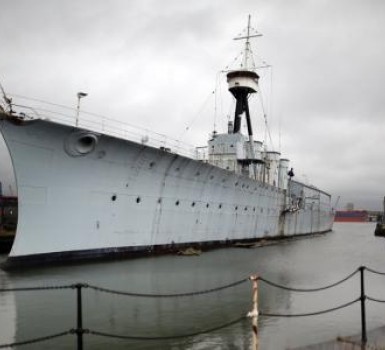 HMS Caroline six months from completion